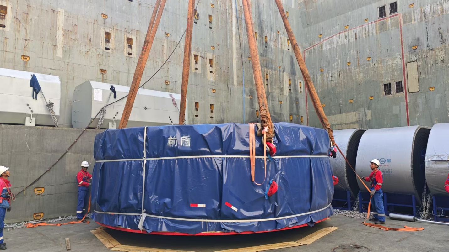 A large round object with a blue tarp